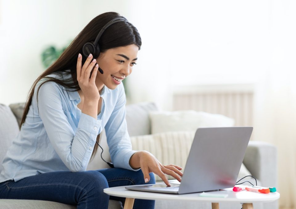 asian-woman-studying-foreign-languages-online-with-laptop-and-headset-at-home.jpg
